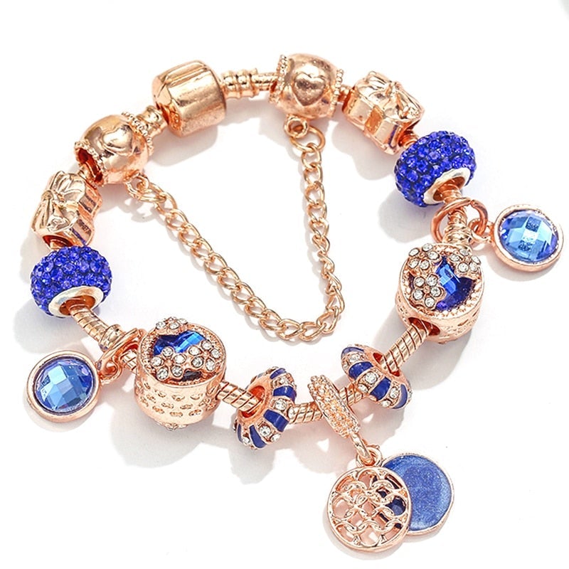 Elegantes Armband aus zartem Rosé-Gold mit funkelndem blauen Kristall