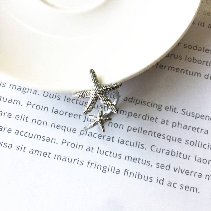 Eleganter verstellbarer Ring im Seestern-Design aus edlem Silber und Gold