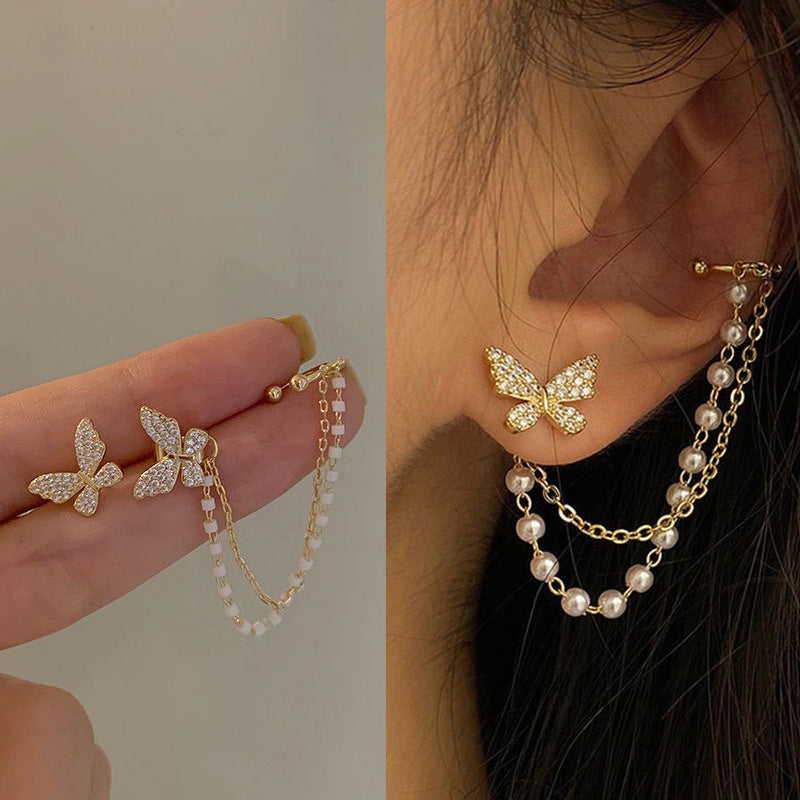 Elegante Schmetterlingsohrringe mit funkelnden Zirkonia und edlen Perlen in Gold