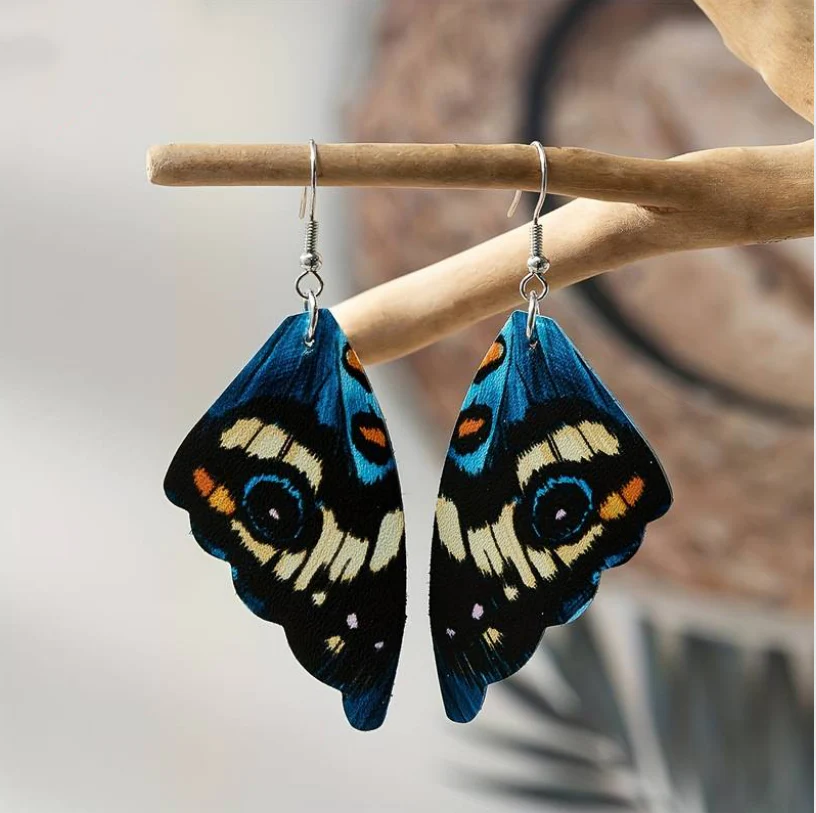Elegante Vintage-Ohrringe mit blauem Schmetterlingsflügel-Design