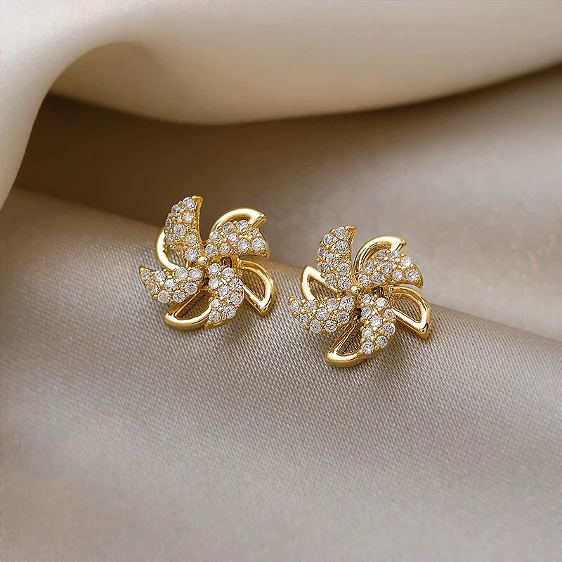 Elegante Gold-Pinwheel-Ohrringe mit funkelnden Zirkonia