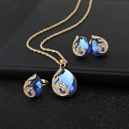 Elegantes Set aus blauer Kristall-Halskette und passenden Ohrringen mit goldenen Akzenten