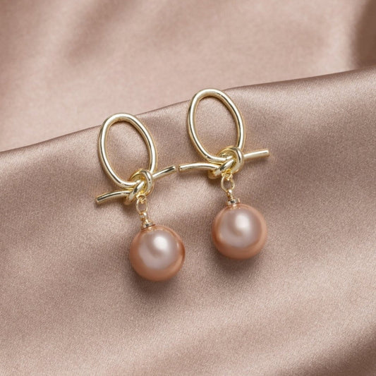 Elegante Goldohrringe mit Perlenschleifen