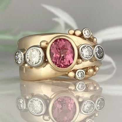 Eleganter Vintage-Ring aus Gold mit strahlendem roten Zirkon