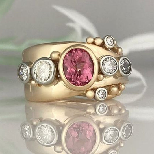 Eleganter Vintage-Ring aus Gold mit strahlendem roten Zirkon