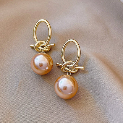 Elegante Goldohrringe mit Perlenschleifen