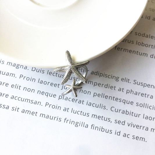 Eleganter verstellbarer Ring im Seestern-Design aus edlem Silber und Gold