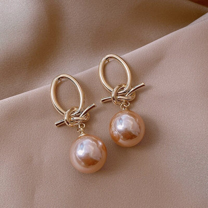 Elegante Goldohrringe mit Perlenschleifen