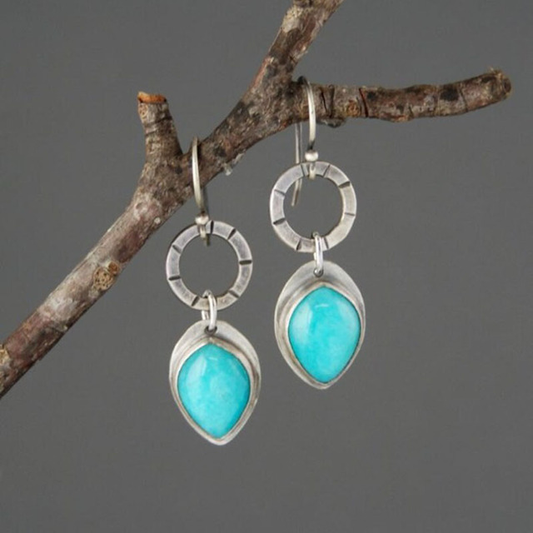 Elegante Vintage-Ohrringe mit strahlendem blauen Stein und feinem Silberdesign